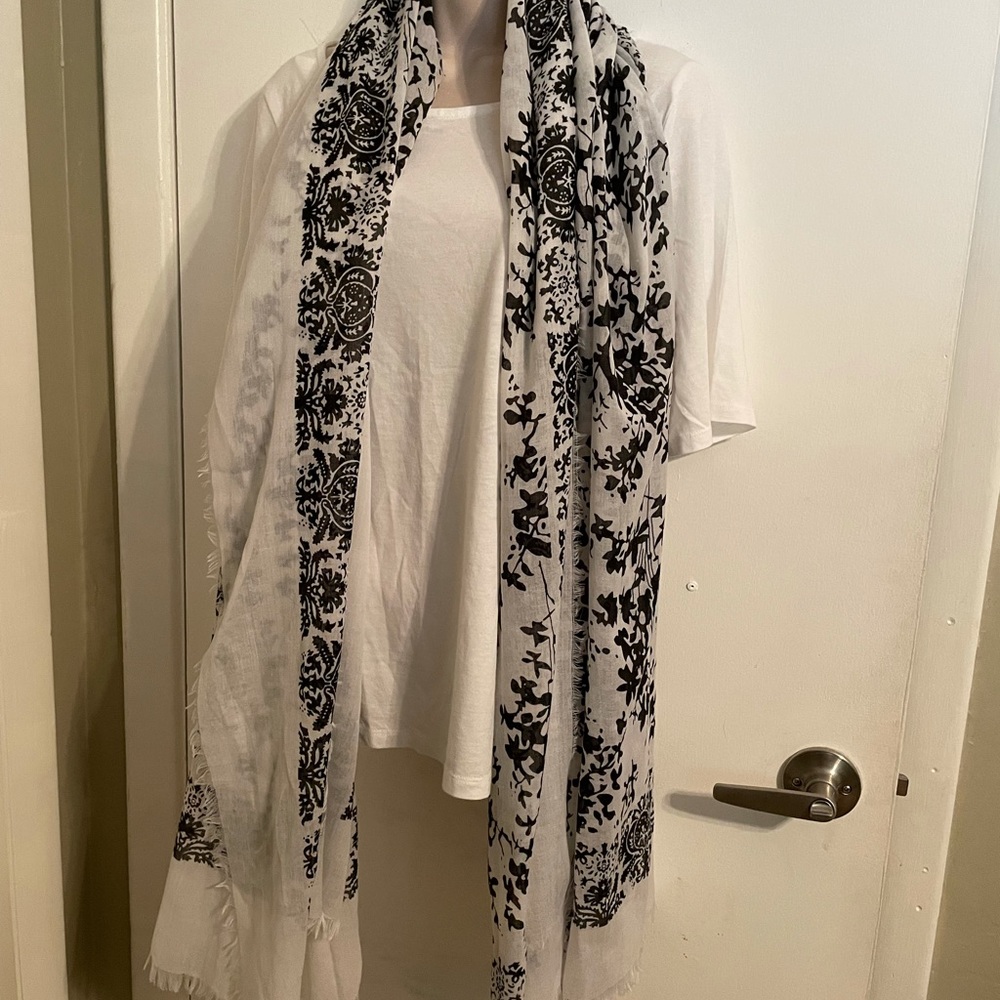 Black and white scarf. 80” square. Fringed.
